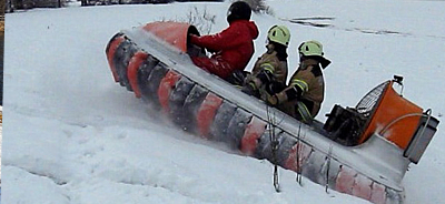 3 person hovercraft climbing snow hill
